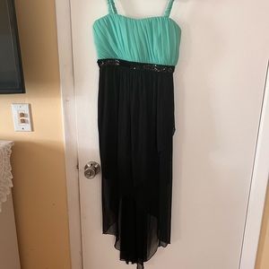 Black split thigh mesh dress with a turquoise top.